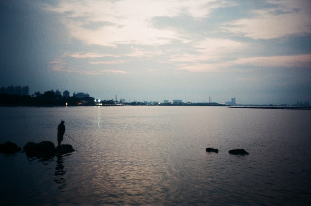 Solitary Evening Fisherman by the Harbour. Shot with Olympus Mju I, Kodal Gold 200 film
